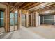 Unfinished basement featuring wood beams, framed walls, and concrete floor ready for customization at 239 E Wesley Ne Rd, Atlanta, GA 30305