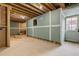 Unfinished basement with exposed ceiling, framed walls, and concrete floor ready for customization at 239 E Wesley Ne Rd, Atlanta, GA 30305