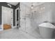 Elegant bathroom featuring a freestanding tub, frameless glass shower, and stylish tile flooring at 239 E Wesley Ne Rd, Atlanta, GA 30305