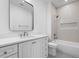 Modern bathroom with tiled shower and tub combination, vanity with storage, and designer mirror at 239 E Wesley Ne Rd, Atlanta, GA 30305
