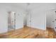 Spacious bedroom with hardwood floors, freshly painted walls, and access to a bathroom at 239 E Wesley Ne Rd, Atlanta, GA 30305