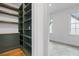 Walk-in closet with custom shelving, drawers, and wood countertop at 239 E Wesley Ne Rd, Atlanta, GA 30305