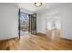Den with black framed glass doors opening to a patio and entry to the main living area at 239 E Wesley Ne Rd, Atlanta, GA 30305