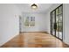 Office/Den featuring hardwood floors, natural light, and black framed glass doors at 239 E Wesley Ne Rd, Atlanta, GA 30305