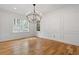 Bright dining room featuring hardwood floors, decorative moldings, and an elegant chandelier at 239 E Wesley Ne Rd, Atlanta, GA 30305