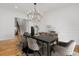 Elegant dining room with a modern chandelier, sleek table, and stylish chairs, perfect for entertaining at 239 E Wesley Ne Rd, Atlanta, GA 30305