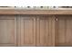 Close-up of wood kitchen island cabinets with matching hardware and a light countertop at 239 E Wesley Ne Rd, Atlanta, GA 30305