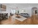 Bright living room featuring hardwood floors, a modern sofa, and elegant decor, creating an inviting atmosphere at 239 E Wesley Ne Rd, Atlanta, GA 30305