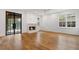 Spacious living room with a fireplace, hardwood floors, and large glass doors at 239 E Wesley Ne Rd, Atlanta, GA 30305