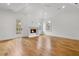 Spacious main bedroom with vaulted ceiling, fireplace, hardwood flooring, and access to a private deck at 239 E Wesley Ne Rd, Atlanta, GA 30305