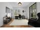 Well-lit home office with a large window, modern desk, and comfortable seating, ideal for productivity at 239 E Wesley Ne Rd, Atlanta, GA 30305