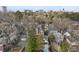 Scenic street view of homes nestled among lush trees with a city skyline in the distance at 239 E Wesley Ne Rd, Atlanta, GA 30305