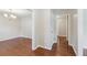 Hallway featuring hardwood floors, fresh paint, and entry to dining area at 1231 Sanden Ferry Dr, Decatur, GA 30033