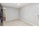 A bright kitchen area with tile flooring and neutral walls at 1231 Sanden Ferry Dr, Decatur, GA 30033