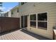 Private back porch featuring neutral siding and door to the home at 1537 Liberty Nw Pkwy, Atlanta, GA 30318