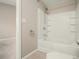 This bathroom features a tub with a shower, tile floors, and a towel rack at 1537 Liberty Nw Pkwy, Atlanta, GA 30318