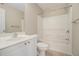 Bathroom view featuring a white vanity, tiled floor, and shower-tub combo at 1537 Liberty Nw Pkwy, Atlanta, GA 30318