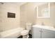 Modern bathroom featuring a shower-over-tub with stylish tiling and a vanity with ample storage at 1537 Liberty Nw Pkwy, Atlanta, GA 30318