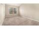 Cozy bedroom with neutral carpet, a window for natural light, and a closet at 1537 Liberty Nw Pkwy, Atlanta, GA 30318