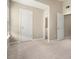 Bedroom view featuring neutral walls, carpet, and two white doors at 1537 Liberty Nw Pkwy, Atlanta, GA 30318