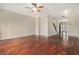 Open-concept living room featuring hardwood floors, access to the staircase, and access to the kitchen at 1537 Liberty Nw Pkwy, Atlanta, GA 30318