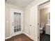 Room features hardwood flooring, a door to the outside, and a bathroom at 1537 Liberty Nw Pkwy, Atlanta, GA 30318