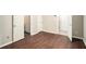 Room featuring hardwood flooring, neutral walls, and multiple doors at 1537 Liberty Nw Pkwy, Atlanta, GA 30318