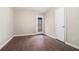 Room showcases hardwood flooring and a door to the outside at 1537 Liberty Nw Pkwy, Atlanta, GA 30318