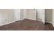 This room features hardwood flooring, neutral walls, and three doors at 1537 Liberty Nw Pkwy, Atlanta, GA 30318