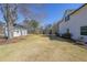 Spacious backyard featuring a trampoline and a charming swing set near the detached garage at 2982 N Main Nw St, Kennesaw, GA 30144