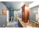 Bathroom featuring a double vanity, granite countertops, a glass-enclosed shower, and dark paint at 2982 N Main Nw St, Kennesaw, GA 30144