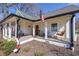 Inviting front porch with rocking chairs, swing and neatly landscaped yard at 2982 N Main Nw St, Kennesaw, GA 30144