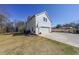 Exterior view of the detached garage featuring a white facade and driveway with a basketball hoop at 2982 N Main Nw St, Kennesaw, GA 30144