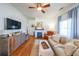 Living room featuring hardwood floors, fireplace, and ample natural light at 2982 N Main Nw St, Kennesaw, GA 30144