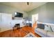 Living room featuring hardwood floors, a fireplace and a comfortable seating area at 2982 N Main Nw St, Kennesaw, GA 30144