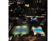 Breathtaking aerial view showcasing the tennis court, and sparkling swimming pools at night at 3445 Stratford Ne Rd # 1605, Atlanta, GA 30326