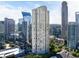 Upscale condo with a luxurious pool and tennis court, surrounded by lush trees and city views at 3445 Stratford Ne Rd # 1605, Atlanta, GA 30326