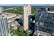 Luxurious high-rise condo with a community pool, lush landscaping, and surrounding views at 3445 Stratford Ne Rd # 1605, Atlanta, GA 30326