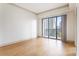 Bright bedroom featuring a balcony with sliding glass doors and gorgeous city views at 3445 Stratford Ne Rd # 1605, Atlanta, GA 30326