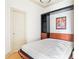 Cozy bedroom with pull-down murphy bed, shelving, and artwork at 3445 Stratford Ne Rd # 1605, Atlanta, GA 30326