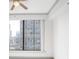 Bedroom with ceiling fan and a large window for city views at 3445 Stratford Ne Rd # 1605, Atlanta, GA 30326