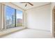 Sunlit bedroom featuring a large window with city views and neutral carpet at 3445 Stratford Ne Rd # 1605, Atlanta, GA 30326