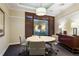 Conference room with round table, chairs, and natural light from a large window at 3445 Stratford Ne Rd # 1605, Atlanta, GA 30326