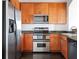 Updated kitchen featuring stainless steel appliances, wood cabinets, and granite countertops at 3445 Stratford Ne Rd # 1605, Atlanta, GA 30326