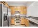 Modern kitchen featuring stainless steel appliances, granite countertops, and ample cabinet space at 3445 Stratford Ne Rd # 1605, Atlanta, GA 30326