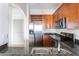 Well-equipped kitchen with stainless steel appliances, granite counters and wood cabinetry at 3445 Stratford Ne Rd # 1605, Atlanta, GA 30326