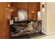 Elegant lobby area featuring a black marble reception desk and wood paneling with orchids and sleek modern lighting at 3445 Stratford Ne Rd # 1605, Atlanta, GA 30326