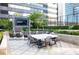 Outdoor dining area with table, chairs, and a large screen TV at 3445 Stratford Ne Rd # 1605, Atlanta, GA 30326