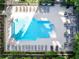 A top-down view of a sparkling pool with lounge chairs for relaxation and sunbathing at 3445 Stratford Ne Rd # 1605, Atlanta, GA 30326