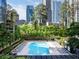 A beautiful in-ground pool surrounded by lounge chairs and trees offers a relaxing escape at 3445 Stratford Ne Rd # 1605, Atlanta, GA 30326